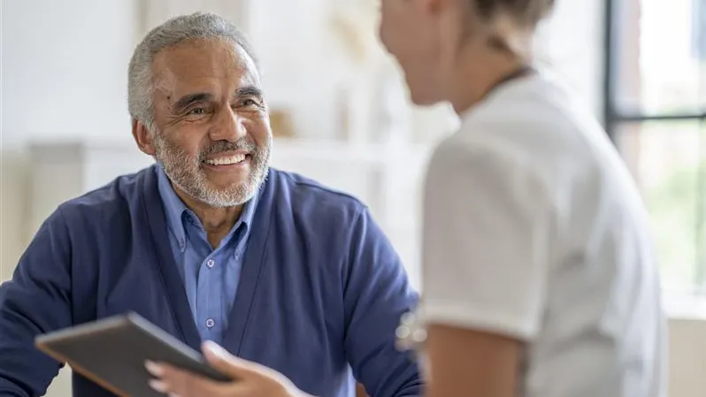 Decorative only image - man over 60 years speaking with health professional 